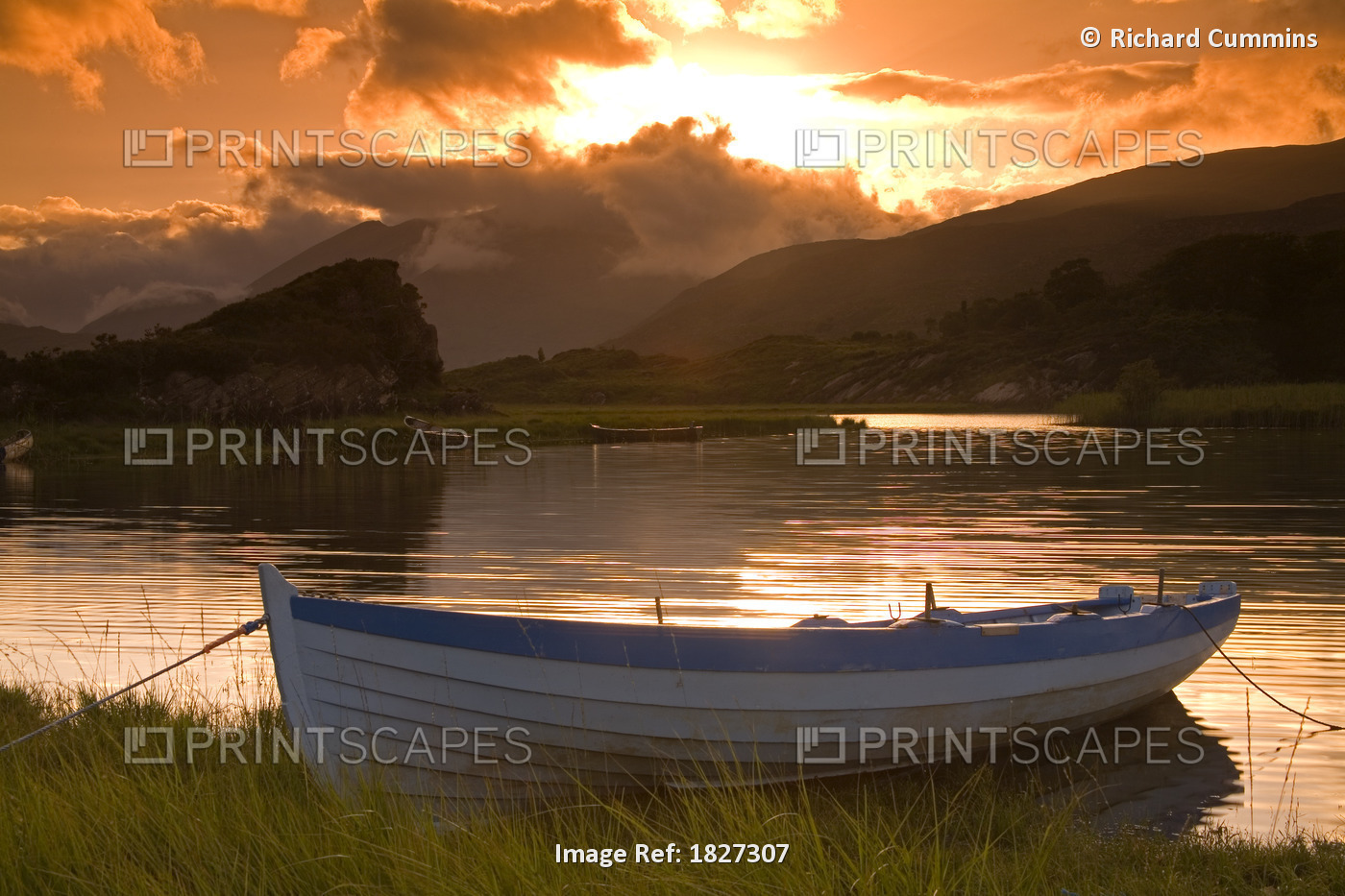 Upper Lake, Killarney National Park, County Kerry, Ireland; Boat At Sunset