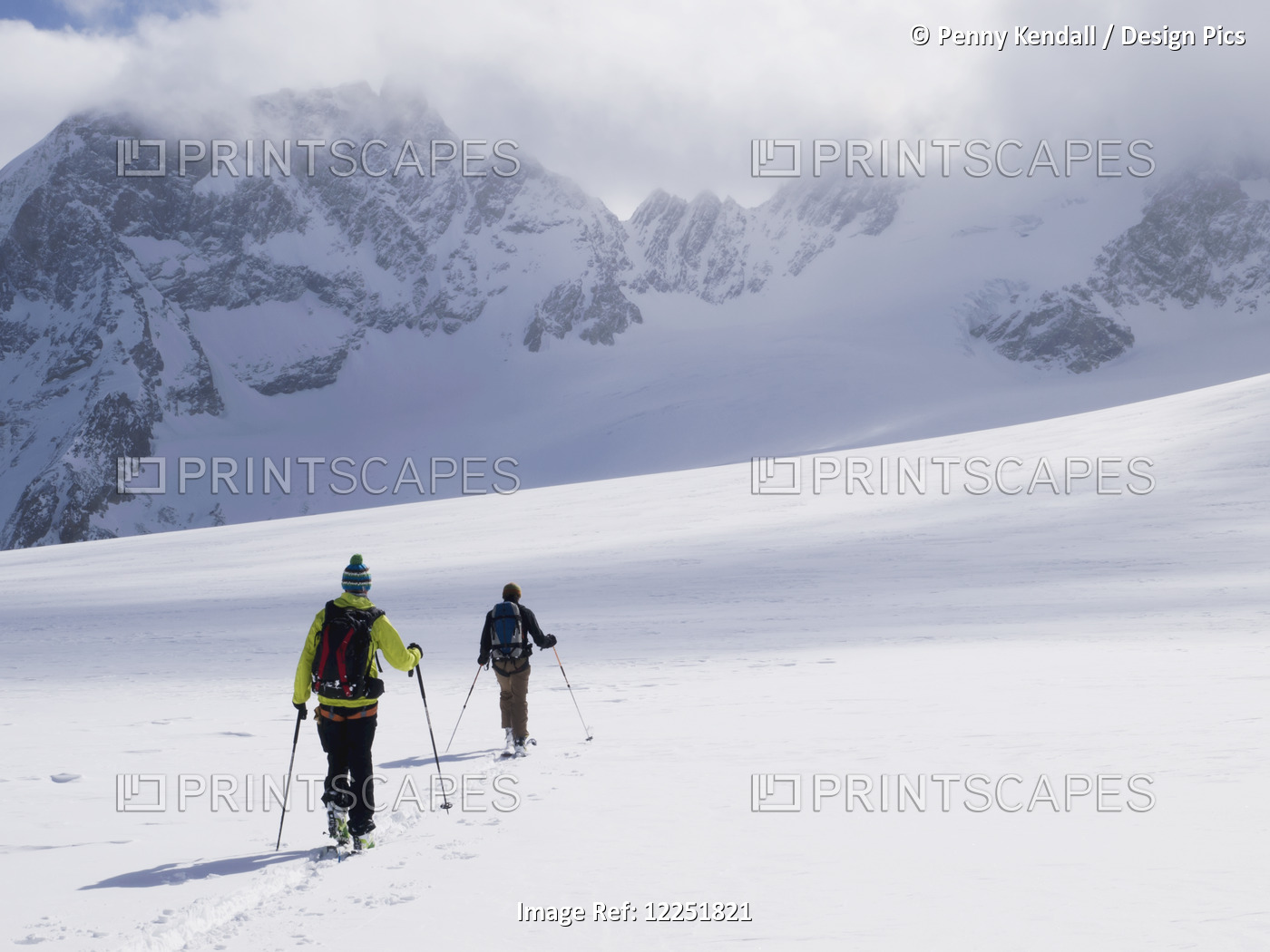 Two Skiers Ski Touring Across The Ottemma Glacier; Switzerland