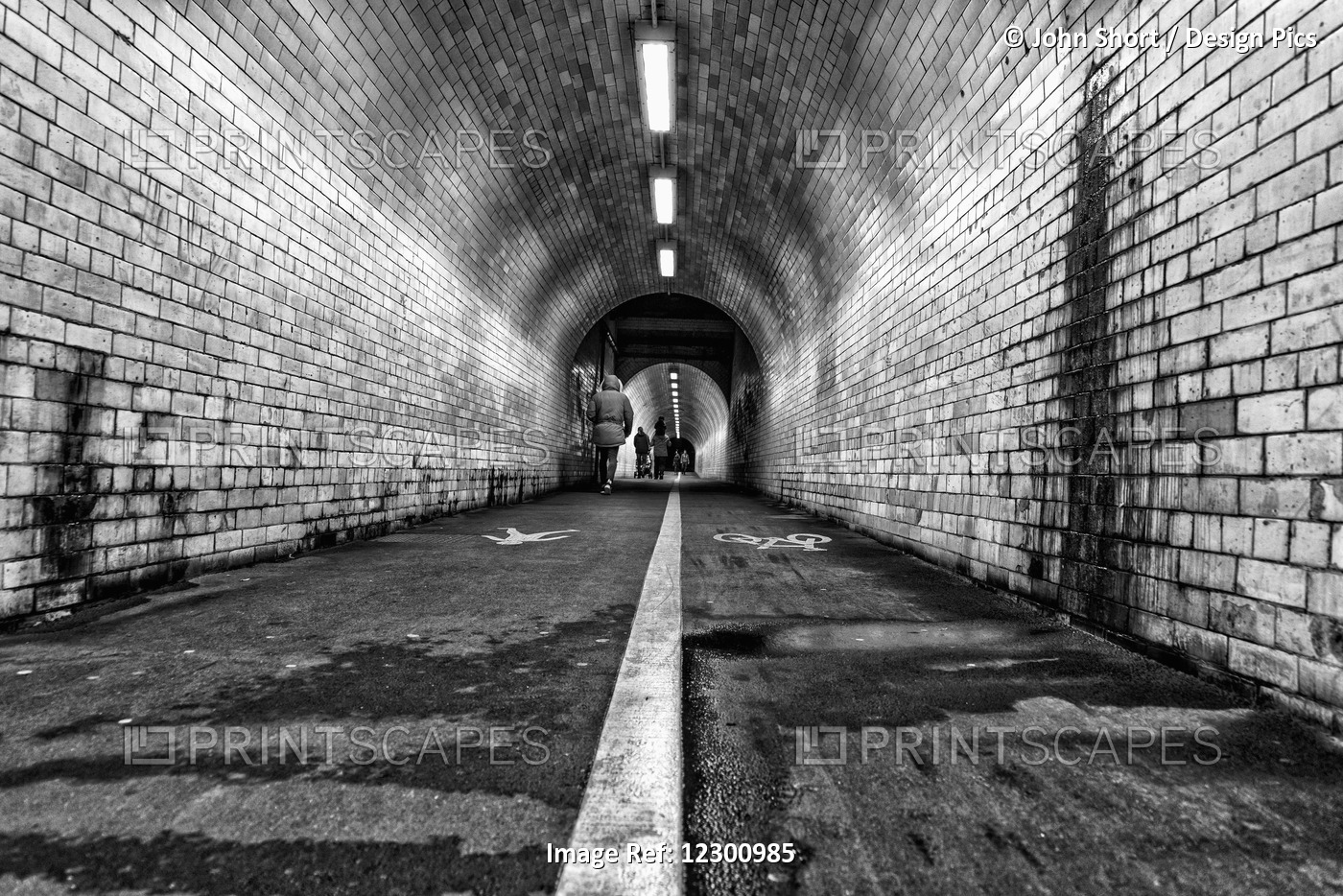 White Line Down The Middle Of A Dirty, Worn Pedestrian And Cycling Tunnel; ...
