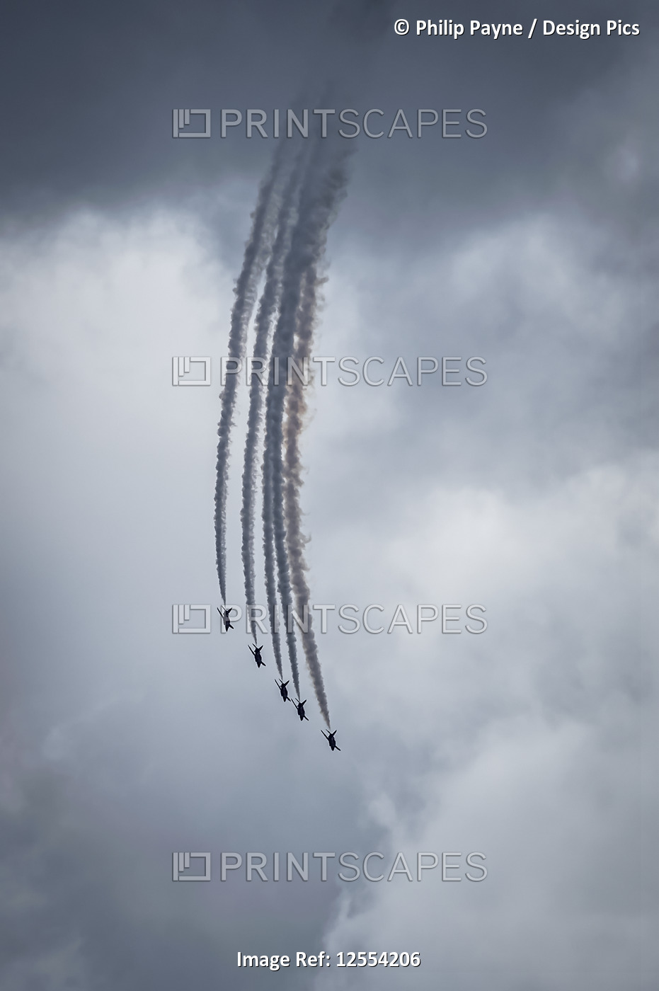 Red Arrows air display, five planes descending in flying formation against grey ...